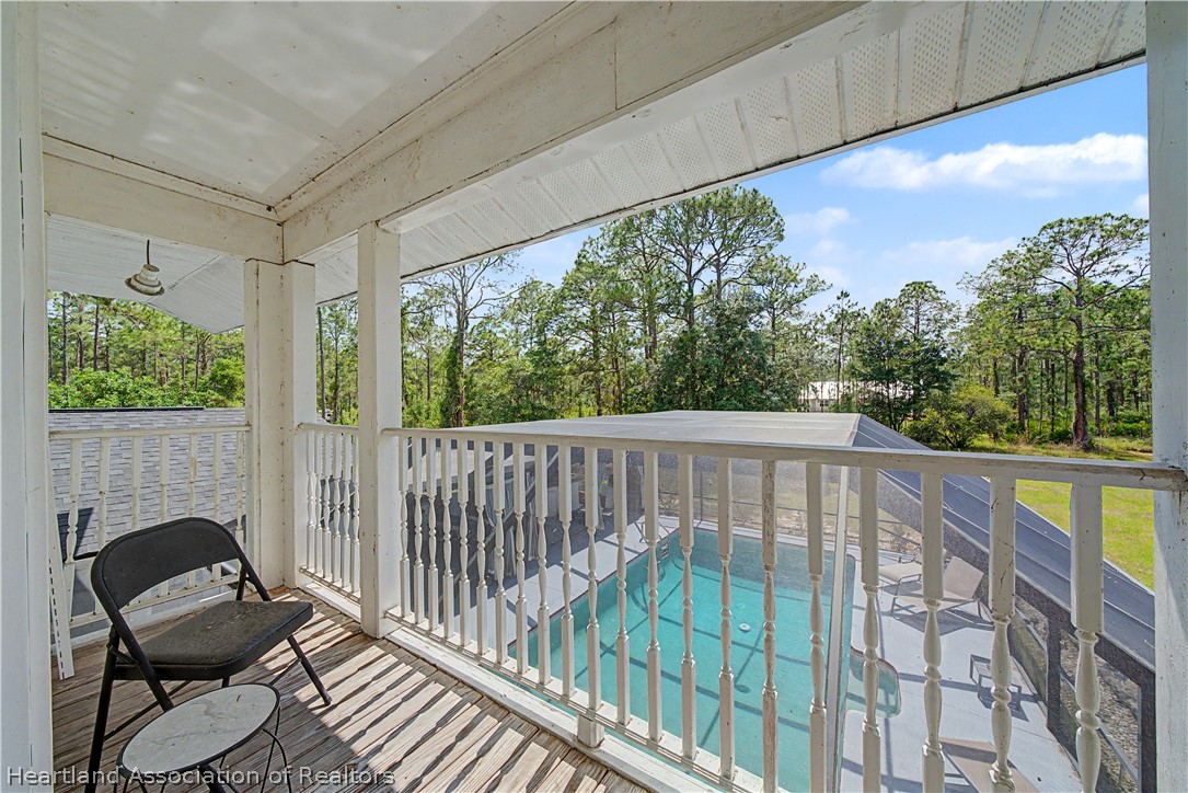 5731 Wolf Lake Road Sebring, FL 33875 - Photo 31 of 45 a view of balcony with furniture