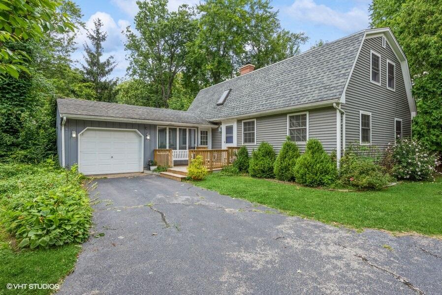 1695 Indian Boundary Road Chesterton, IN 46304 - Photo 1 of 29 a front view of a house with garden