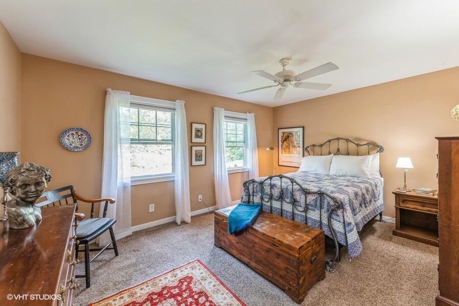 1695 Indian Boundary Road Chesterton, IN 46304 - Photo 17 of 29 a bedroom with a bed and wooden floor