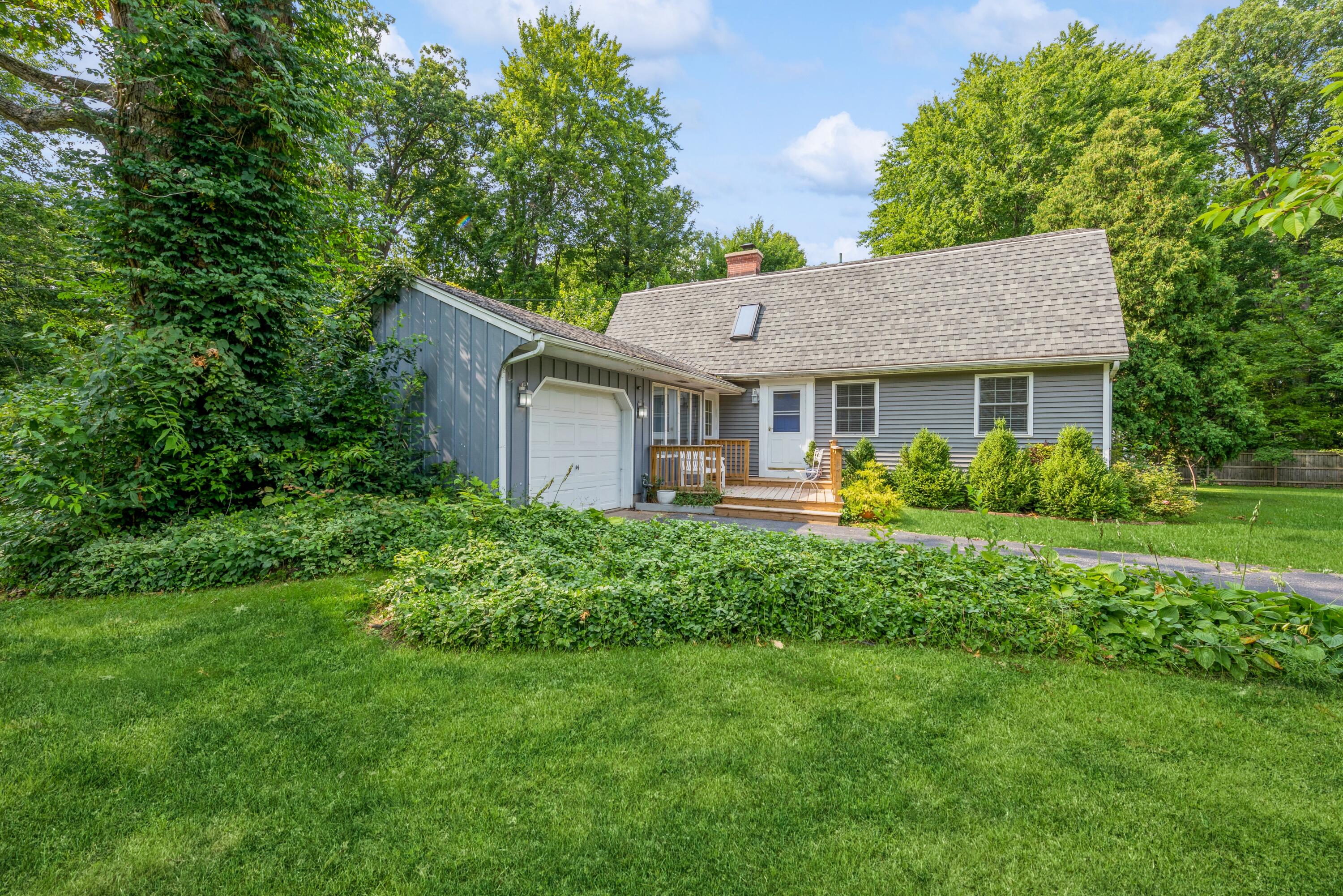 1695 Indian Boundary Road Chesterton, IN 46304 - Photo 2 of 29 a front view of a house with a garden