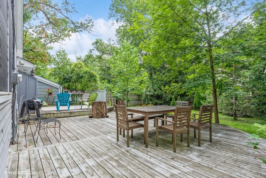 1695 Indian Boundary Road Chesterton, IN 46304 - Photo 23 of 29 a view of a patio with table and chairs and wooden floor