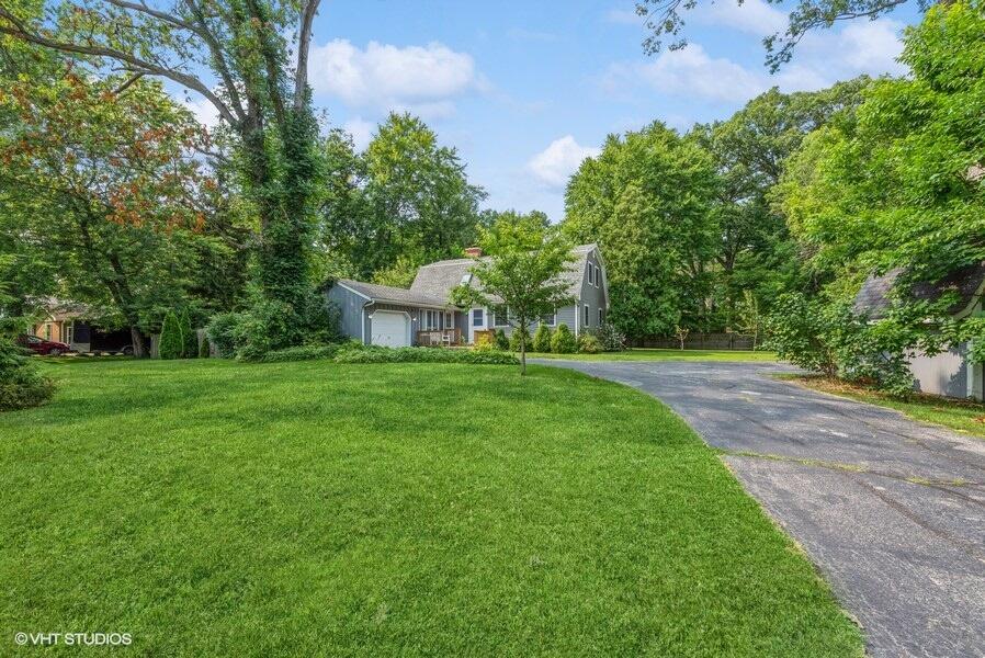 1695 Indian Boundary Road Chesterton, IN 46304 - Photo 4 of 29 a view of a white house with a big yard and large trees