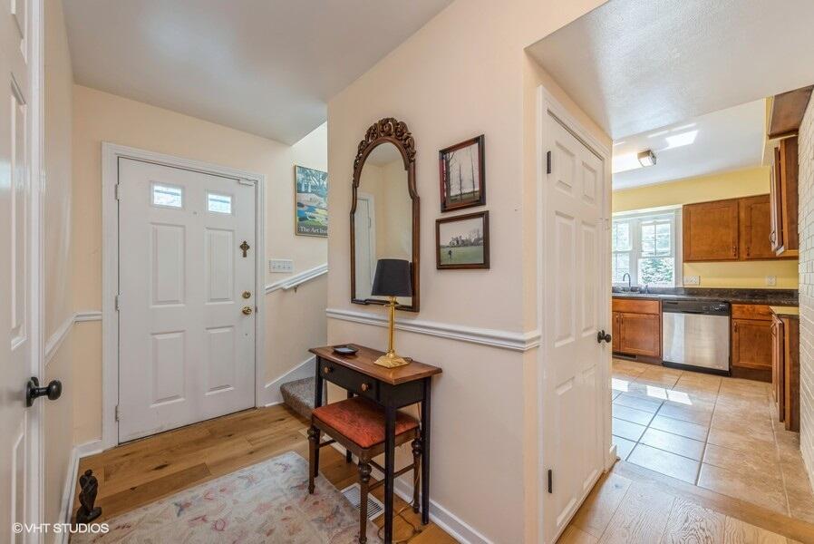 1695 Indian Boundary Road Chesterton, IN 46304 - Photo 5 of 29 a view of a hallway with granite countertop a stove and a sink