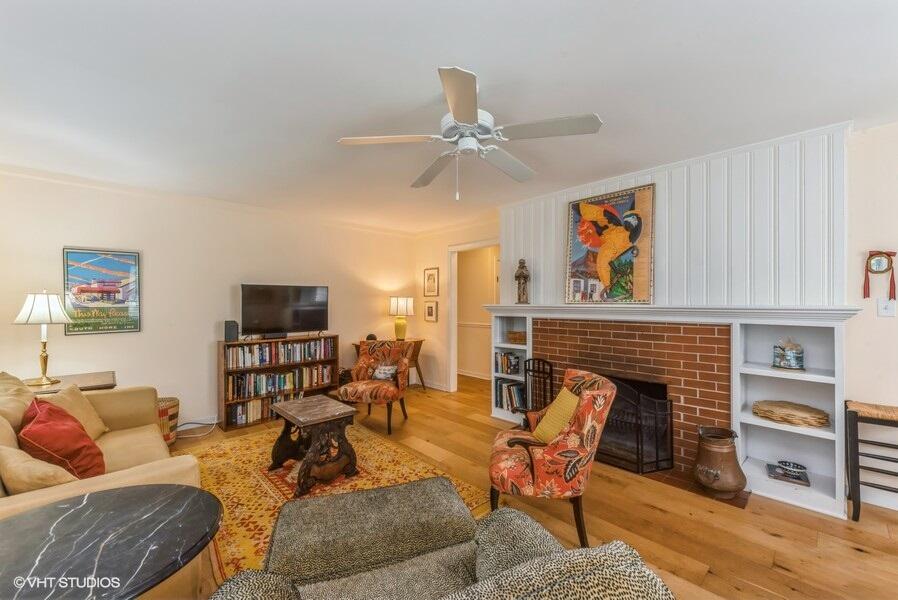 1695 Indian Boundary Road Chesterton, IN 46304 - Photo 6 of 29 a living room with furniture a flat screen tv and a fireplace