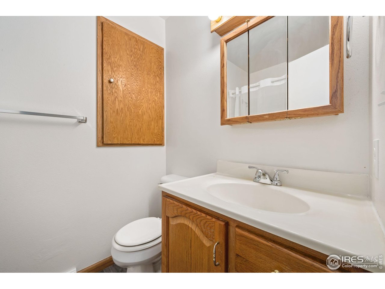 2717 West 26th Street Road Greeley, CO 80634 - Photo 13 of 25 Main floor bathroom with laundry chute