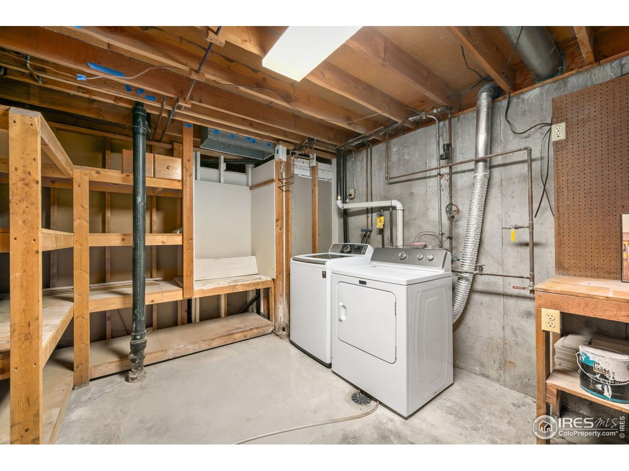 2717 West 26th Street Road Greeley, CO 80634 - Photo 18 of 25 Laundry with laundry chute next to the washer