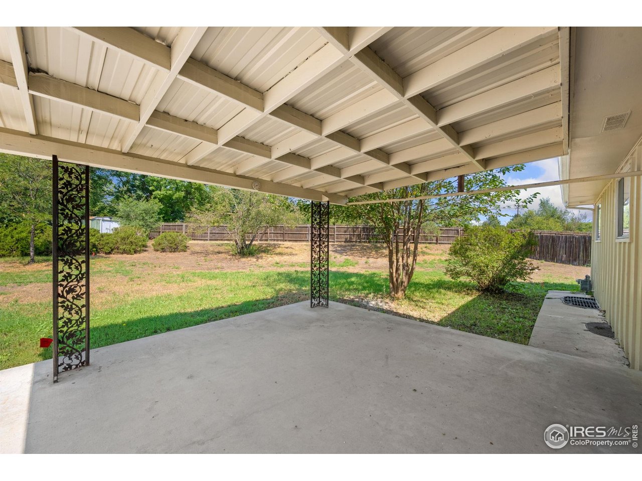 2717 West 26th Street Road Greeley, CO 80634 - Photo 21 of 25 Covered back patio and ENORMOUS rear yard
