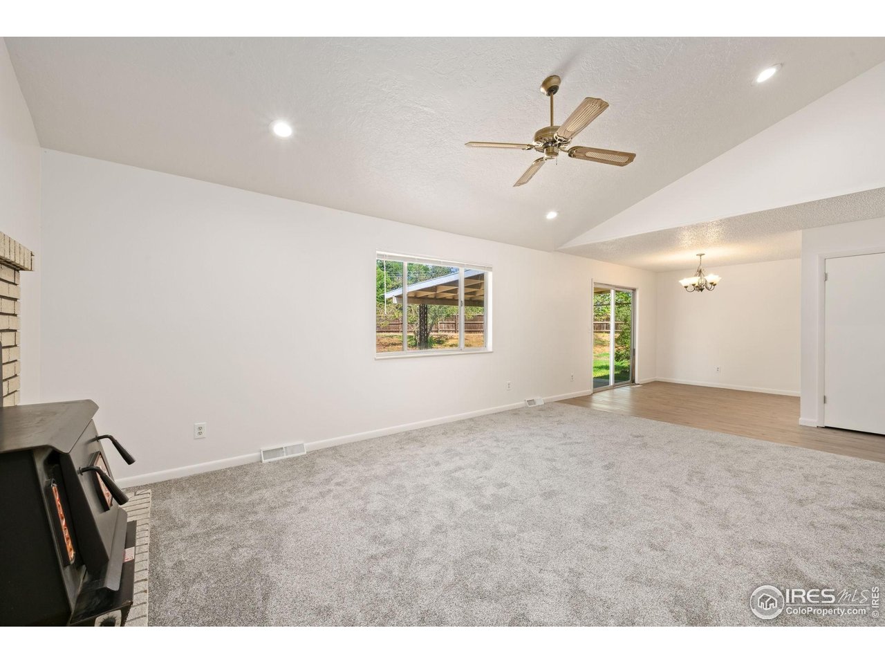 2717 West 26th Street Road Greeley, CO 80634 - Photo 4 of 25 living room to dining room