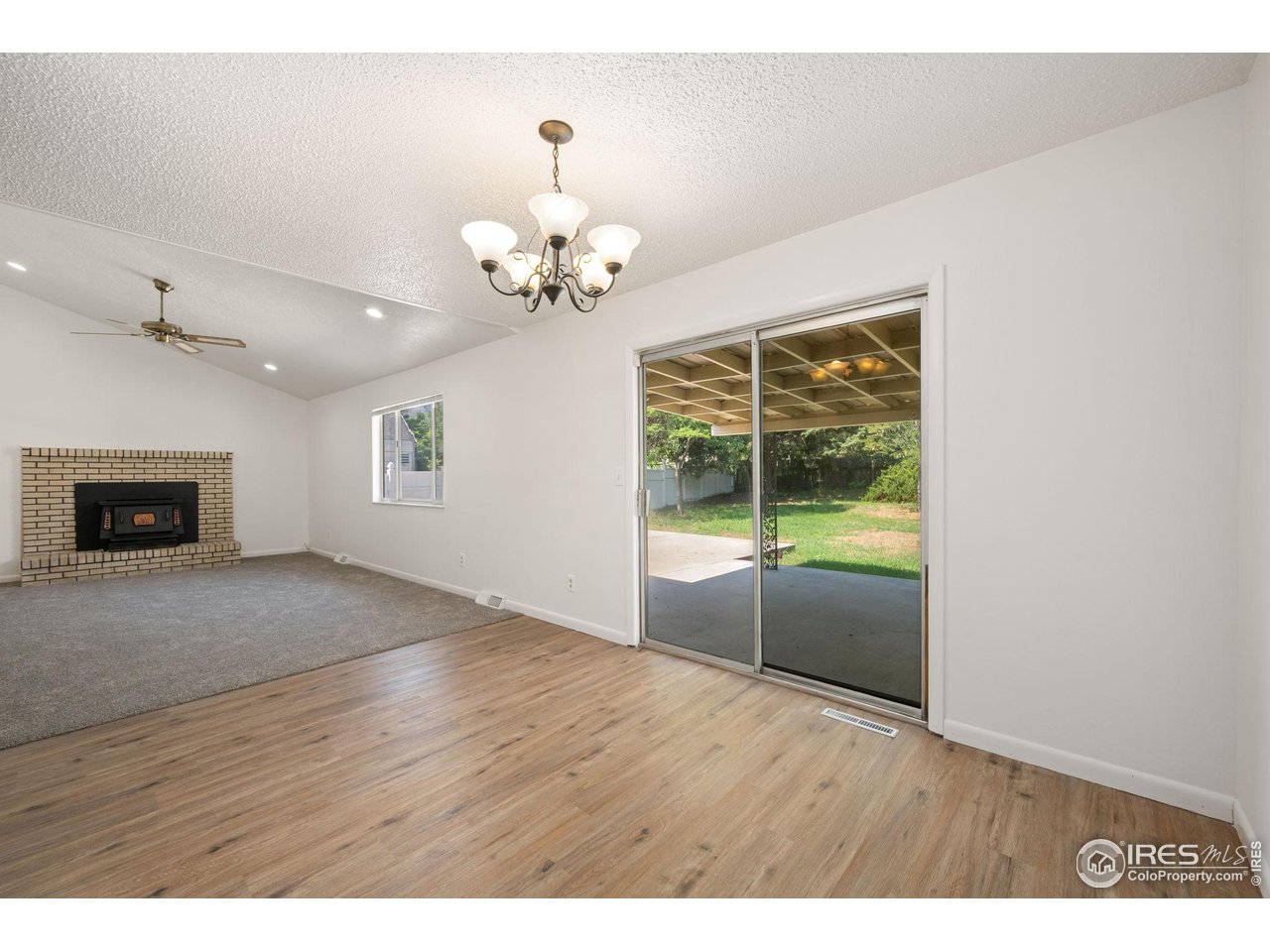 2717 West 26th Street Road Greeley, CO 80634 - Photo 8 of 25 Dining room open to living room