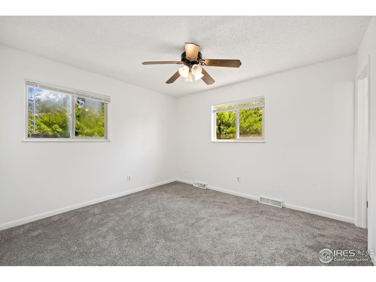 2717 West 26th Street Road Greeley, CO 80634 - Photo 9 of 25 Primary main floor bedroom