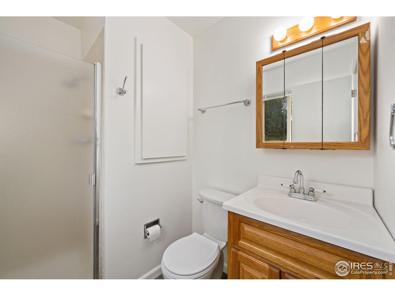 2717 West 26th Street Road Greeley, CO 80634 - Photo 10 of 25 Primary ensuite 3/4 bath with laundry chute