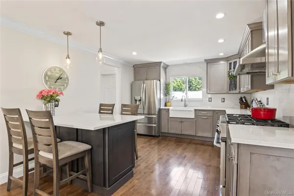 a kitchen that has a table and chairs in it