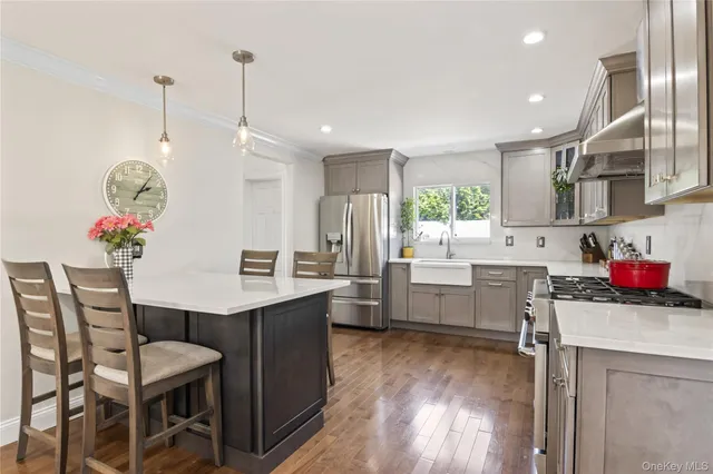 a kitchen that has a table and chairs in it