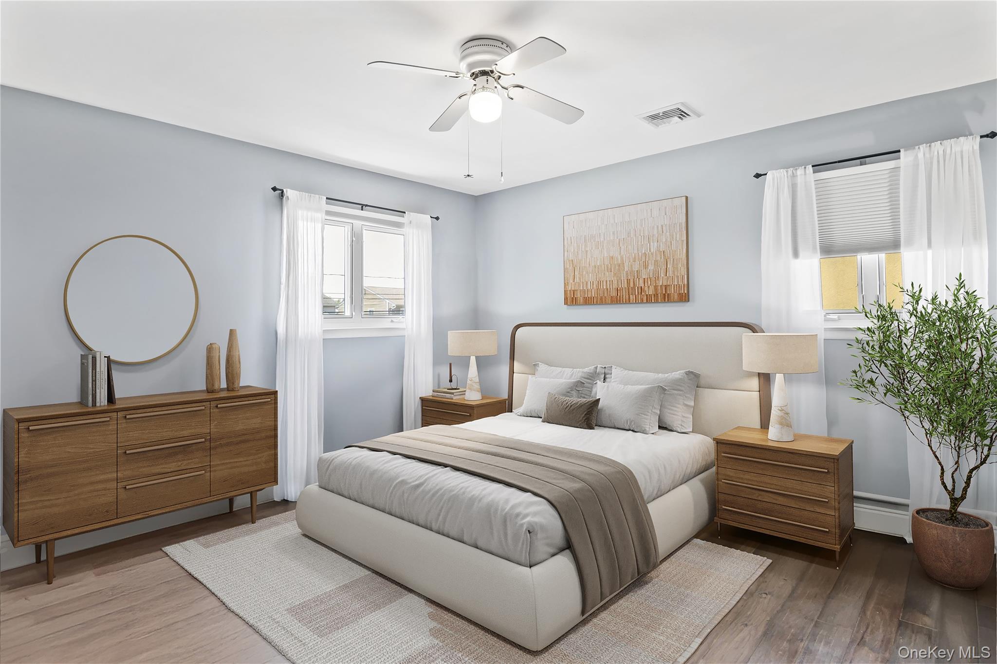 3483 Steven Road Baldwin, NY 11510 - Photo 16 of 30 a bedroom with a bed and a chandelier