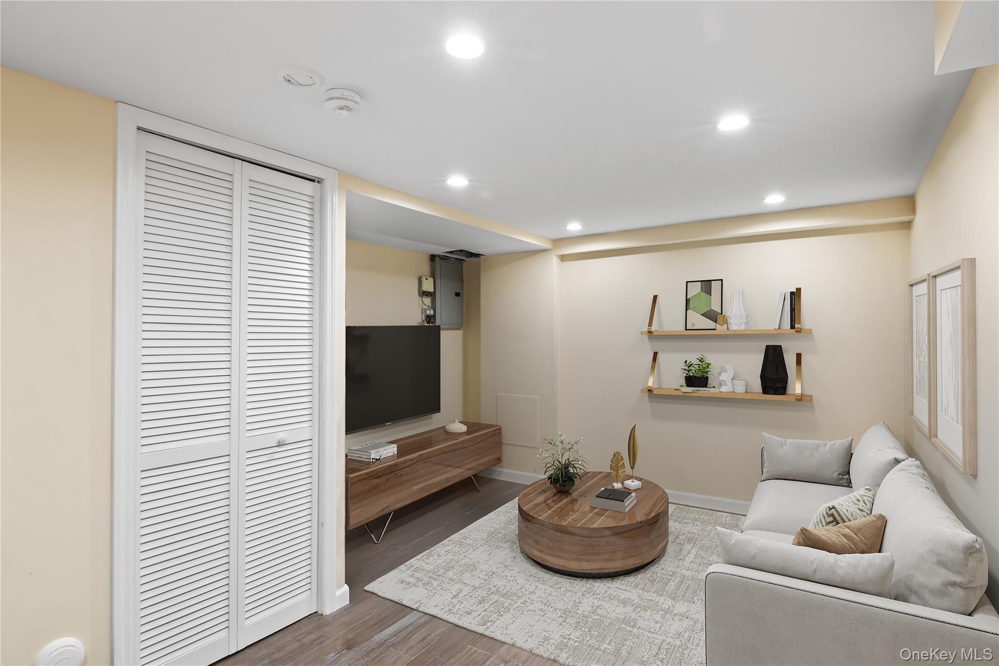 3483 Steven Road Baldwin, NY 11510 - Photo 22 of 30 a living room with furniture and a flat screen tv