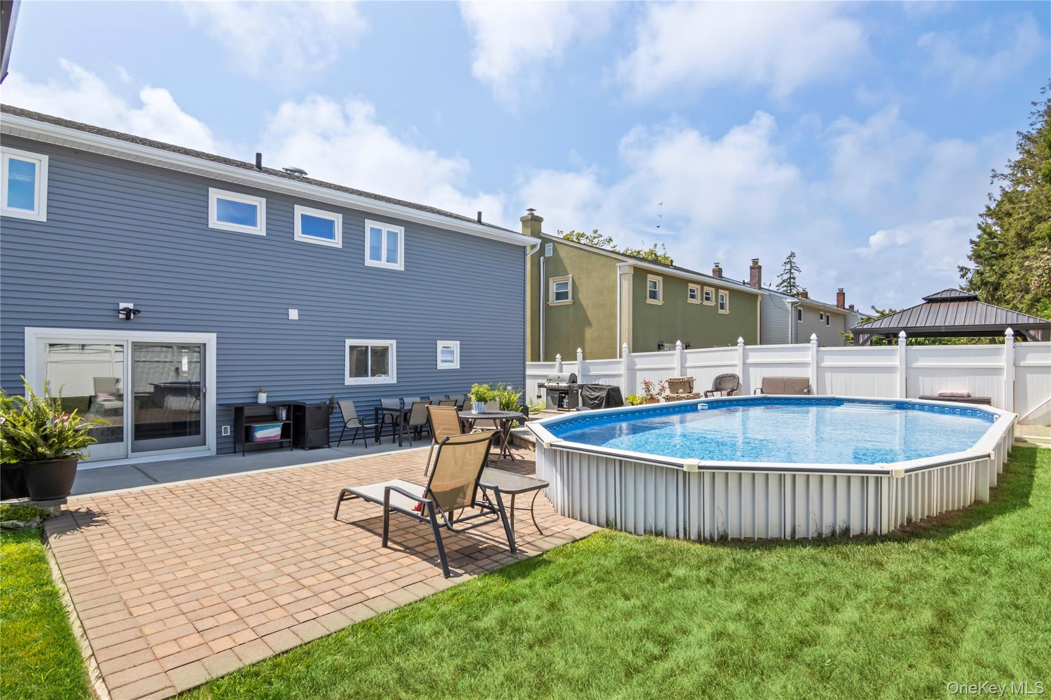 3483 Steven Road Baldwin, NY 11510 - Photo 23 of 30 a swimming pool with outdoor seating yard and barbeque oven