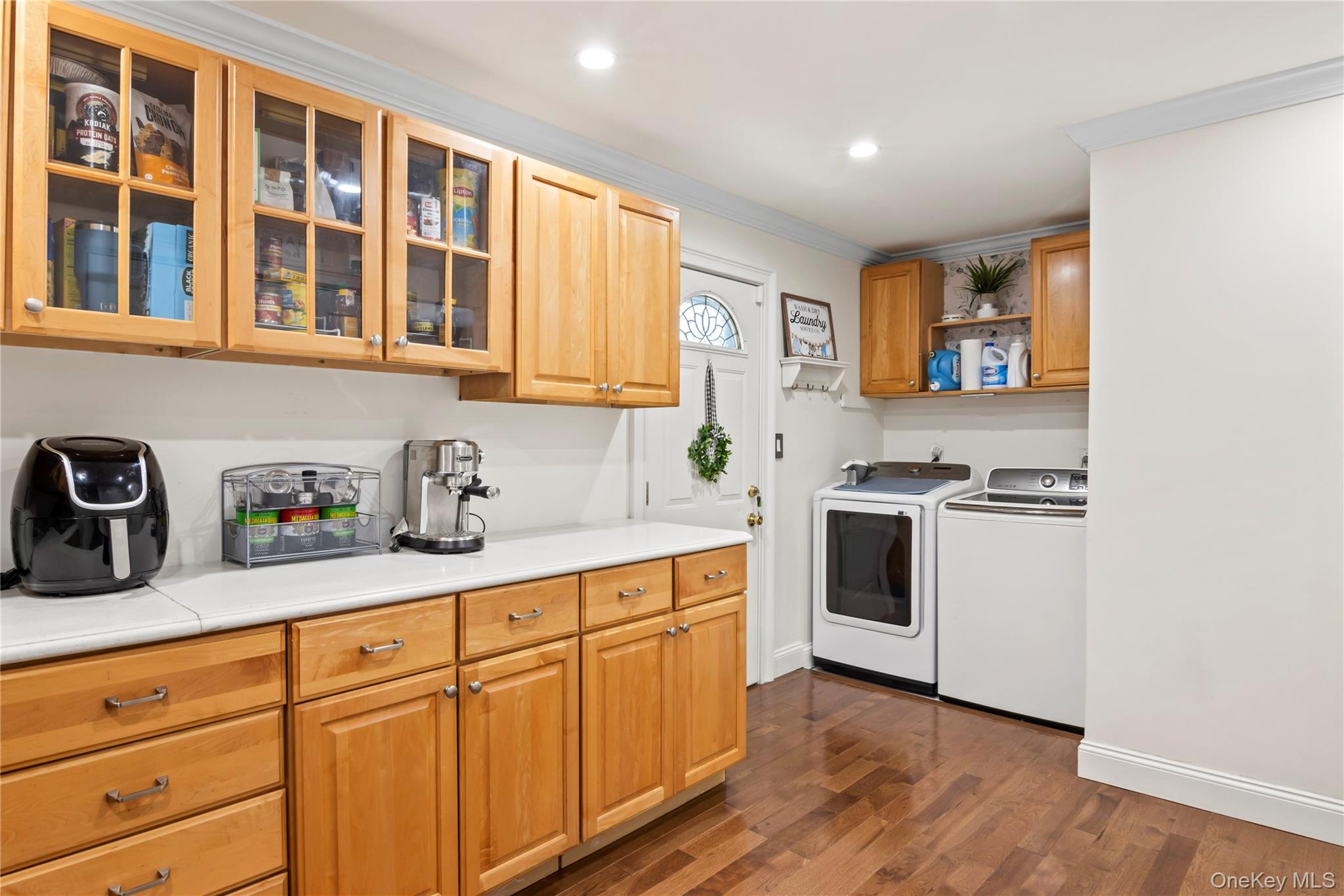 3483 Steven Road Baldwin, NY 11510 - Photo 8 of 30 a kitchen with granite countertop white cabinets and white appliances