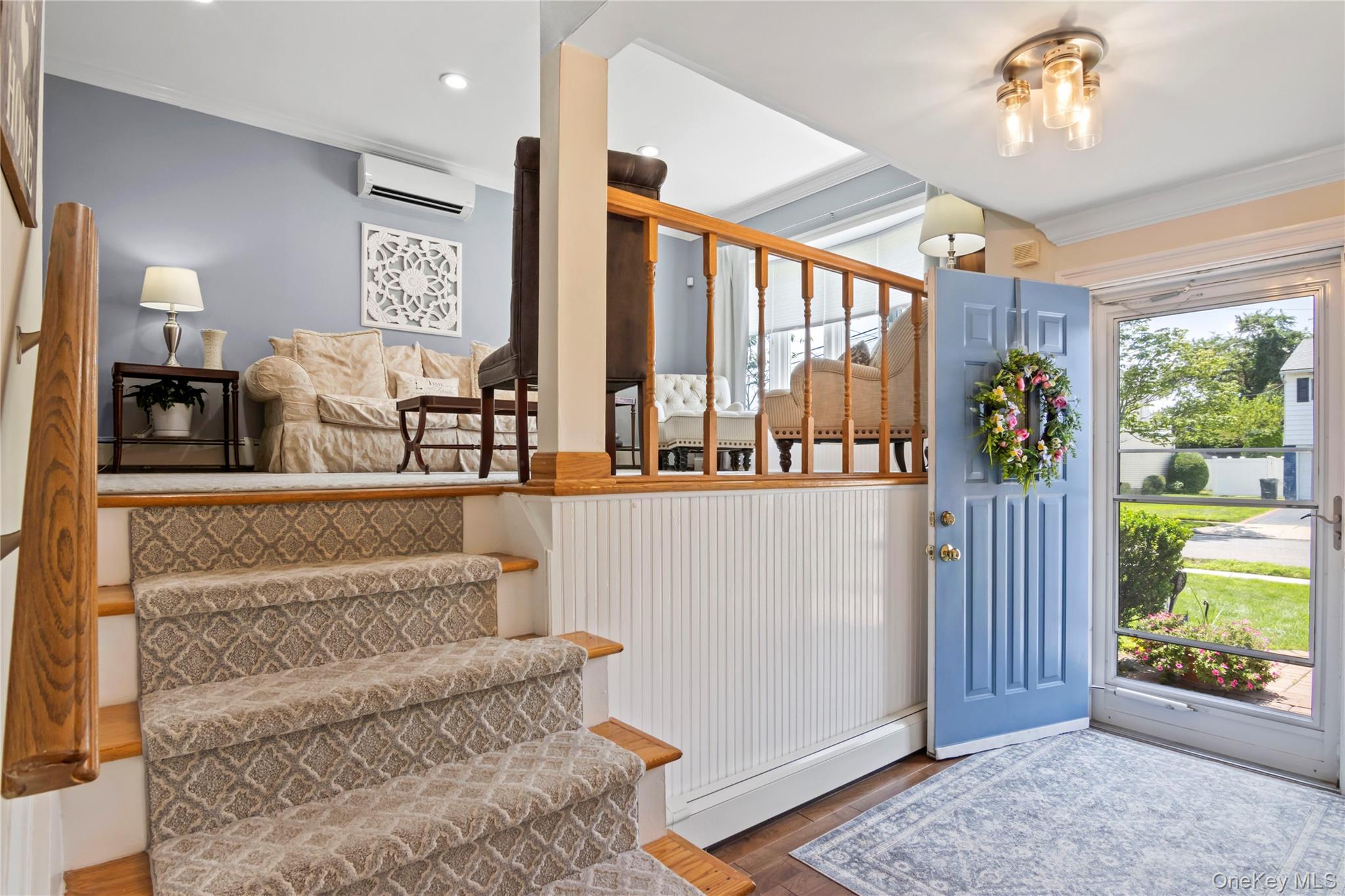 3483 Steven Road Baldwin, NY 11510 - Photo 9 of 30 a living room with furniture and a floor to ceiling window