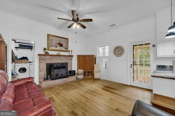 a kitchen with stainless steel appliances granite countertop a stove top oven a sink a counter space and cabinets