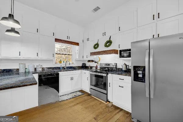 a bed room with a bed and dresser