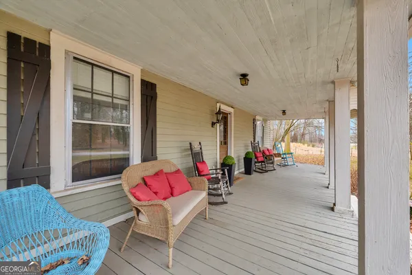 a very nice looking room with wooden floor and furniture