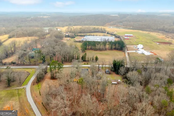 a aerial view of a house with a yard