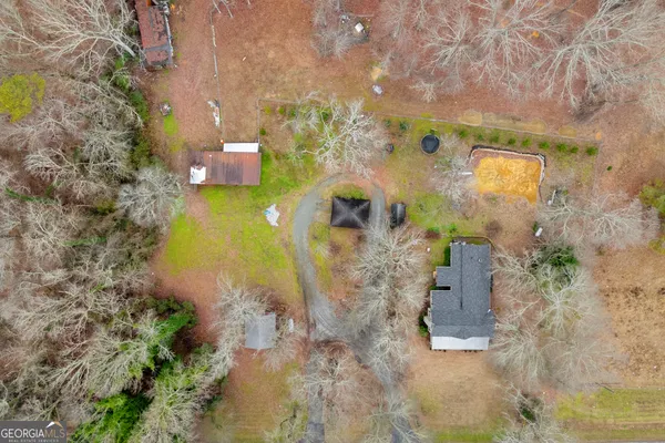 a view of a backyard with a small cabin
