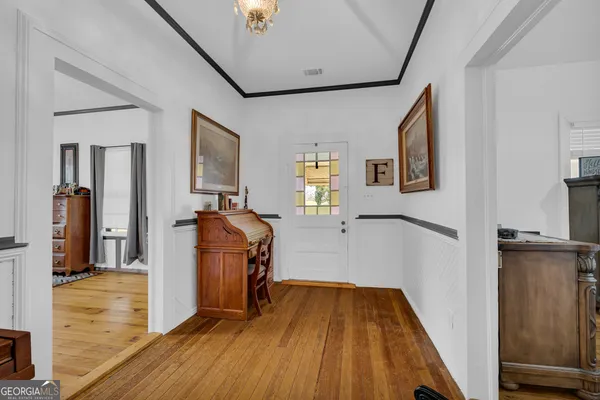 a bedroom with furniture and a window