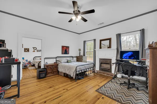 a bedroom with two beds and a chandelier