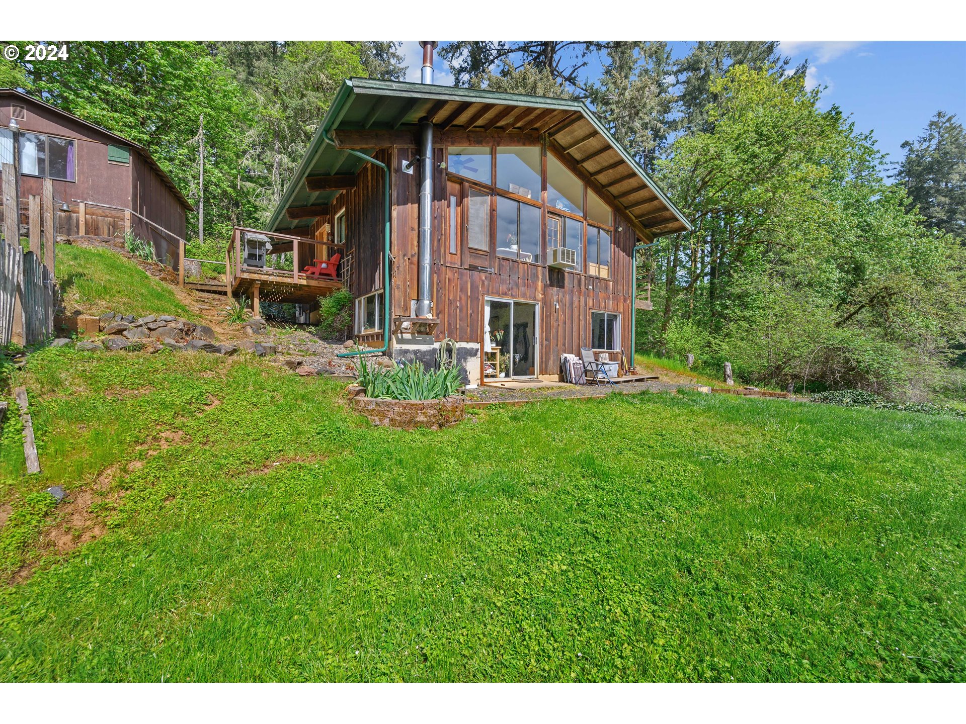14885 Ferns Corner Road Dallas, OR 97338 - Photo 31 of 47 a view of house with backyard outdoor seating and green space