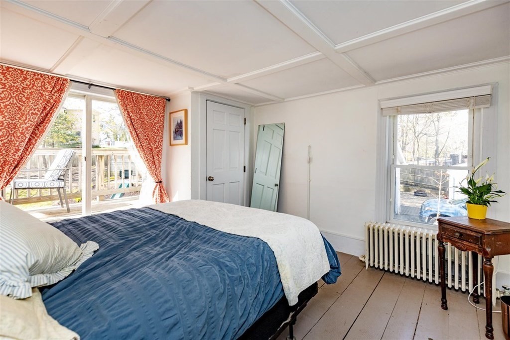 12 Linebrook Road Ipswich, MA 01938 - Photo 14 of 30 a bedroom with a bed and a window