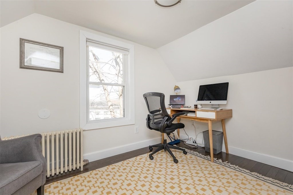 12 Linebrook Road Ipswich, MA 01938 - Photo 22 of 30 a work room with furniture a flat screen tv and a window
