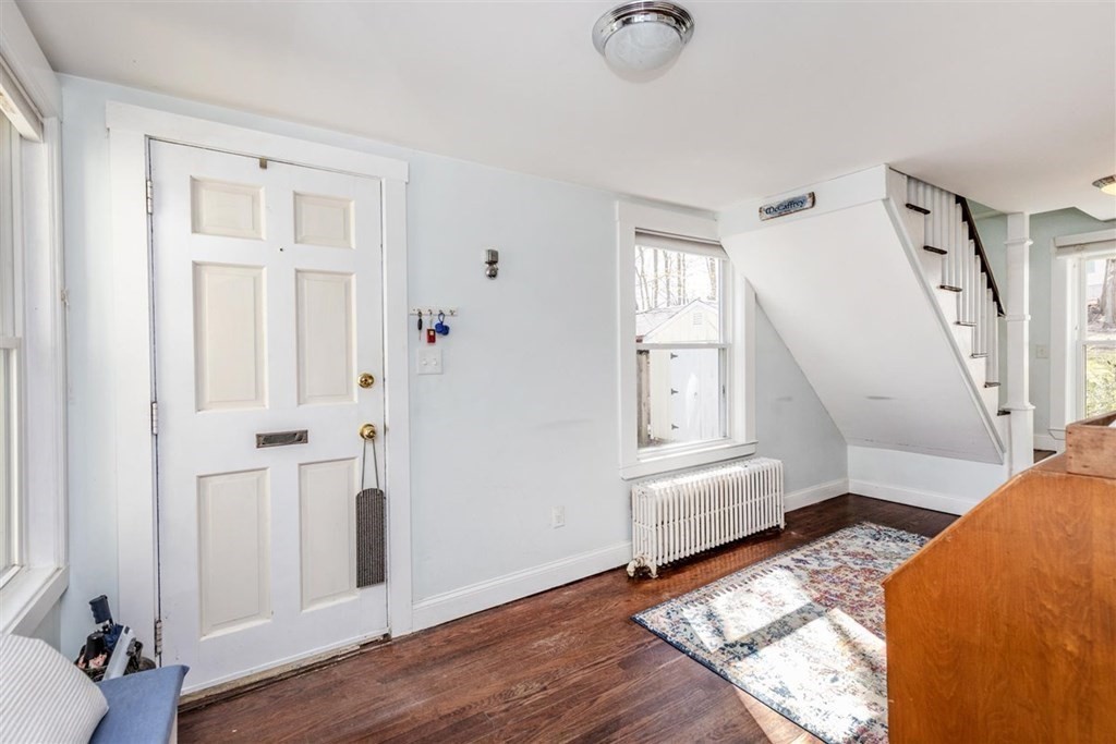 12 Linebrook Road Ipswich, MA 01938 - Photo 3 of 30 a view of a livingroom with wooden floor and cabinet