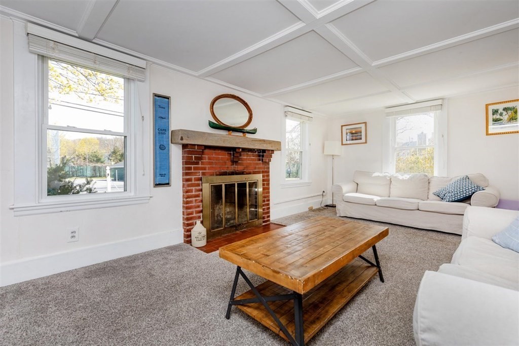12 Linebrook Road Ipswich, MA 01938 - Photo 5 of 30 a living room with furniture a window and a fireplace