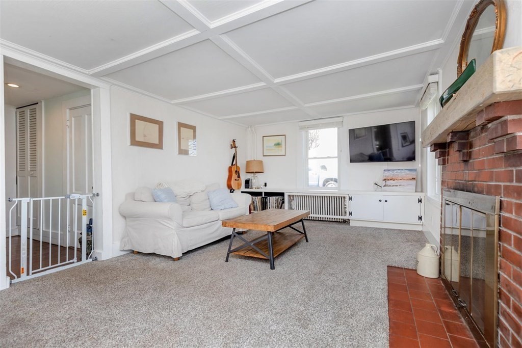 12 Linebrook Road Ipswich, MA 01938 - Photo 7 of 30 a living room with furniture and a flat screen tv