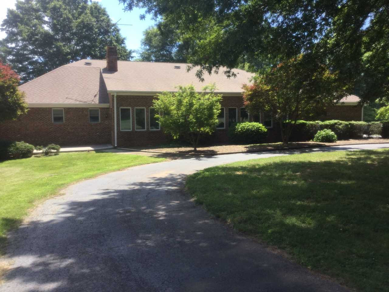 9919 Quail Roost Road Bahama, NC 27503 - Photo 1 of 25 All brick. Looks over pasture area. Home located in middle of property. Rear view