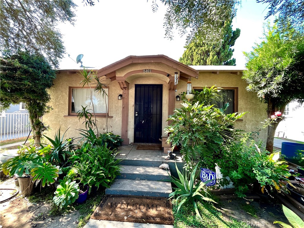 8461 Garden View Avenue South Gate, CA 90280 - Photo 1 of 2 a front view of a house with a yard