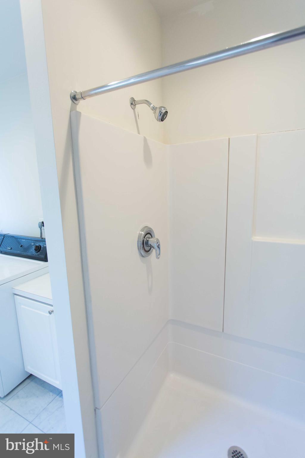 1411-5 Walnut Street, Unit 908 Philadelphia, PA 19102 - Photo 28 of 31 a bathroom with a shower