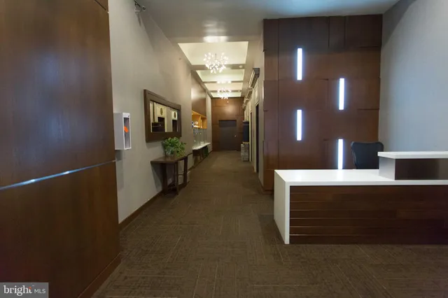 a view of a hallway with seating area