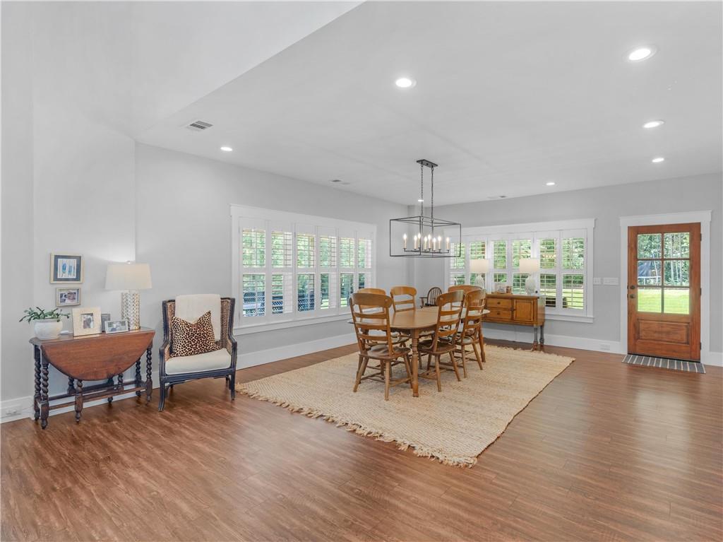 110 Wilson Road Jackson, GA 30233 - Photo 11 of 93 a dining room with furniture a rug and wooden floor