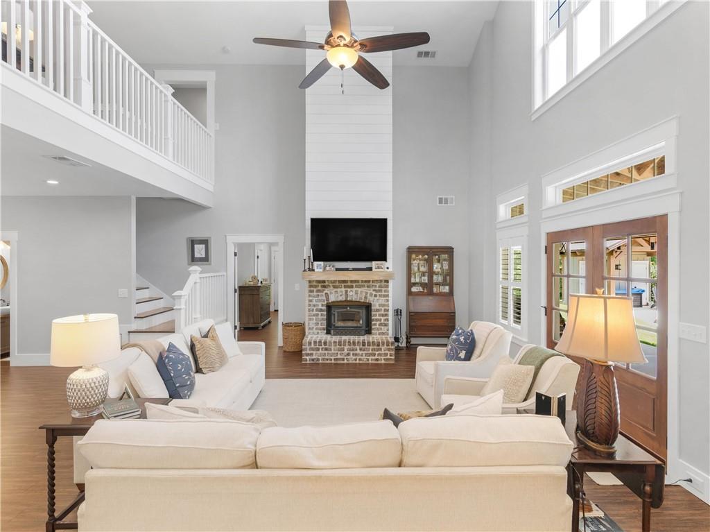 110 Wilson Road Jackson, GA 30233 - Photo 23 of 93 a living room with furniture a fireplace and a flat screen tv