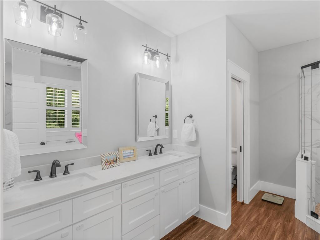 110 Wilson Road Jackson, GA 30233 - Photo 28 of 93 a bathroom with double vanity sink a mirror and a shower