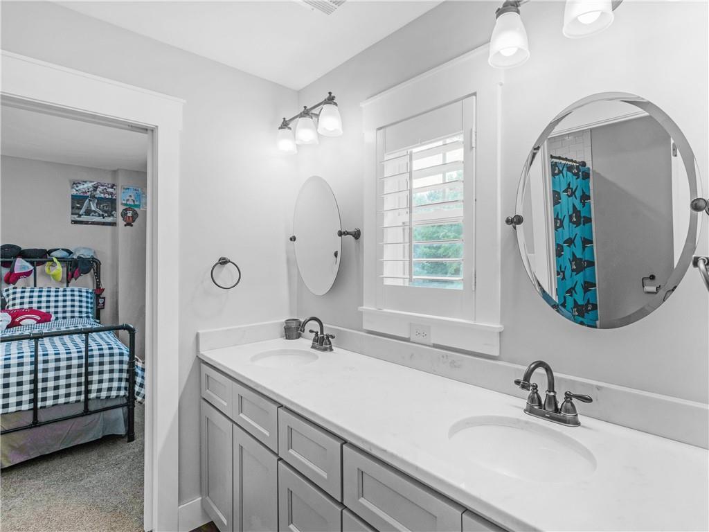 110 Wilson Road Jackson, GA 30233 - Photo 44 of 93 a bathroom with a sink and a mirror