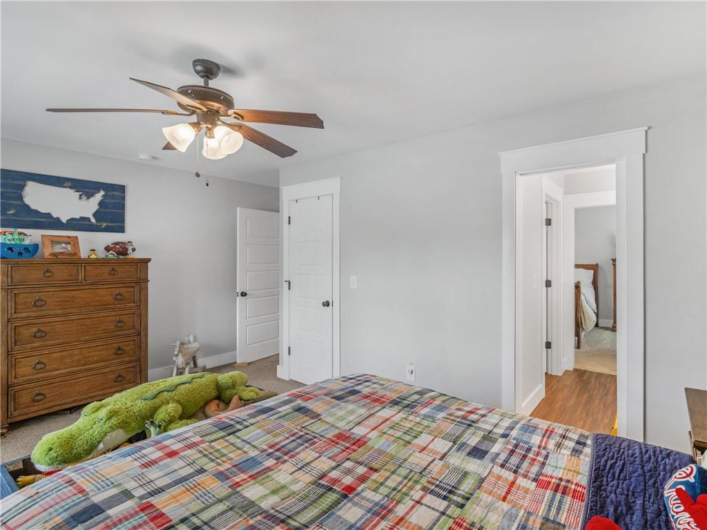 110 Wilson Road Jackson, GA 30233 - Photo 52 of 93 a bedroom with a bed and a dresser in it