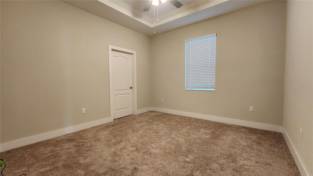 7955 Delwin Lane Reunion, FL 34747 - Photo 14 of 25 an empty room with windows and closet