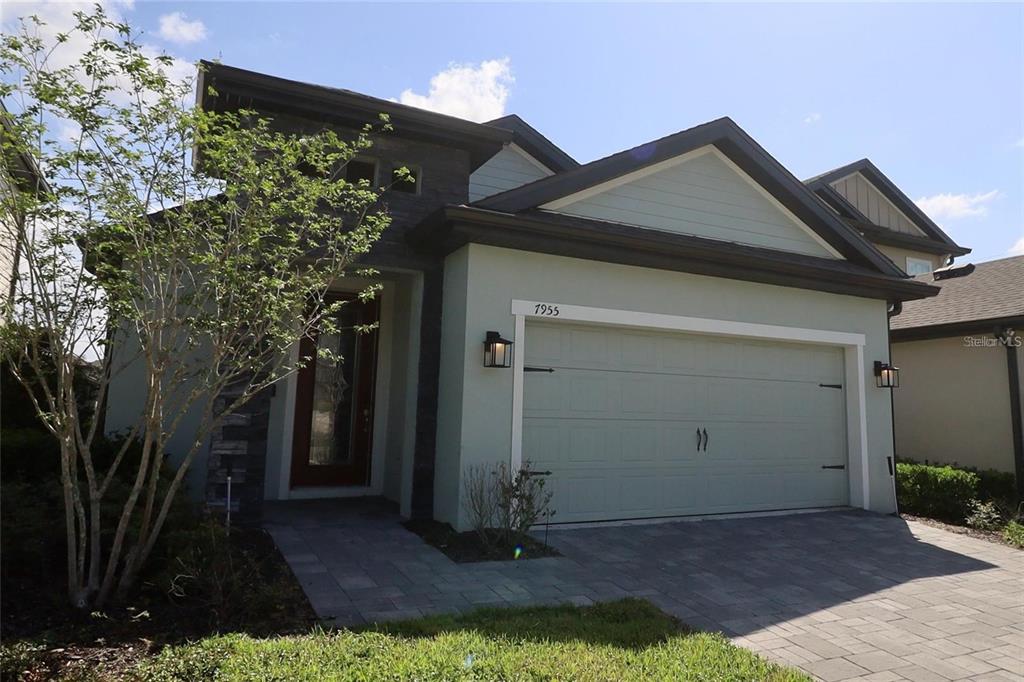 7955 Delwin Lane Reunion, FL 34747 - Photo 2 of 25 a front view of a house with garden
