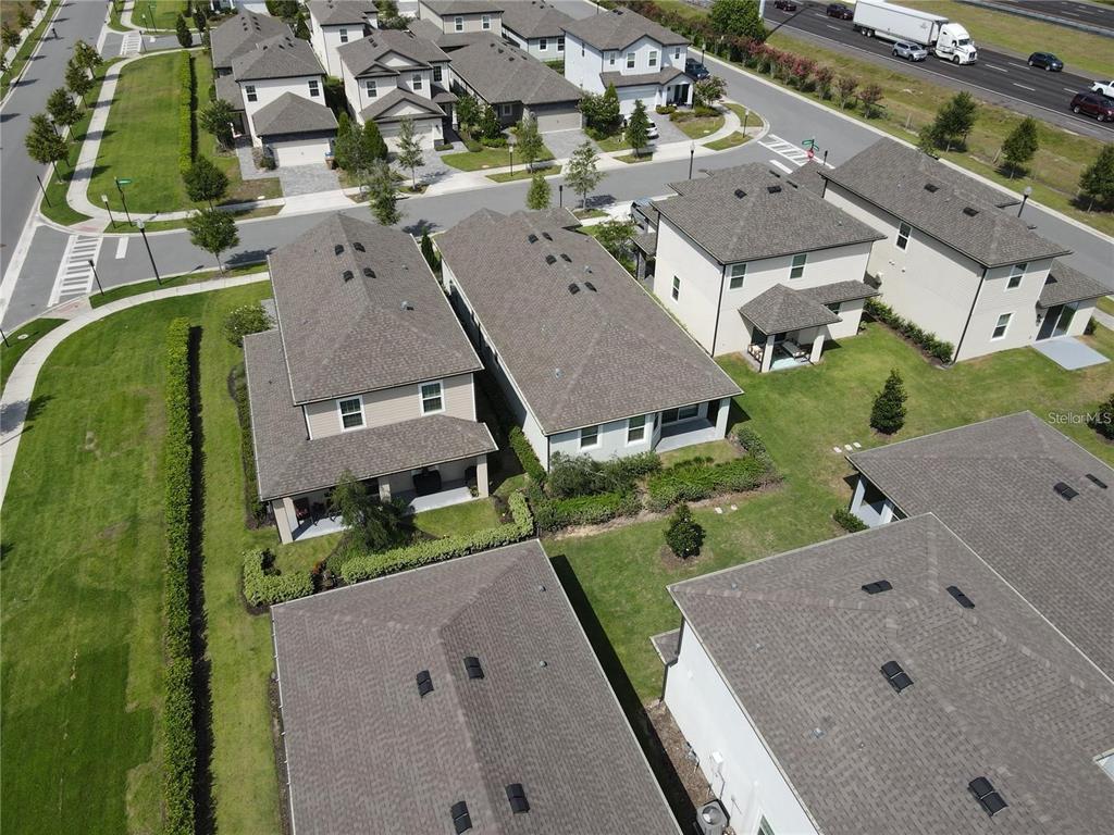 7955 Delwin Lane Reunion, FL 34747 - Photo 23 of 25 an aerial view of a house with a garden