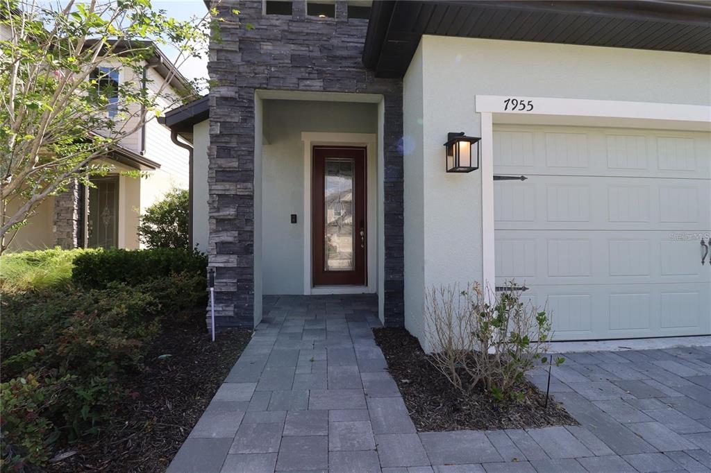 7955 Delwin Lane Reunion, FL 34747 - Photo 3 of 25 a view of a entryway door of the house