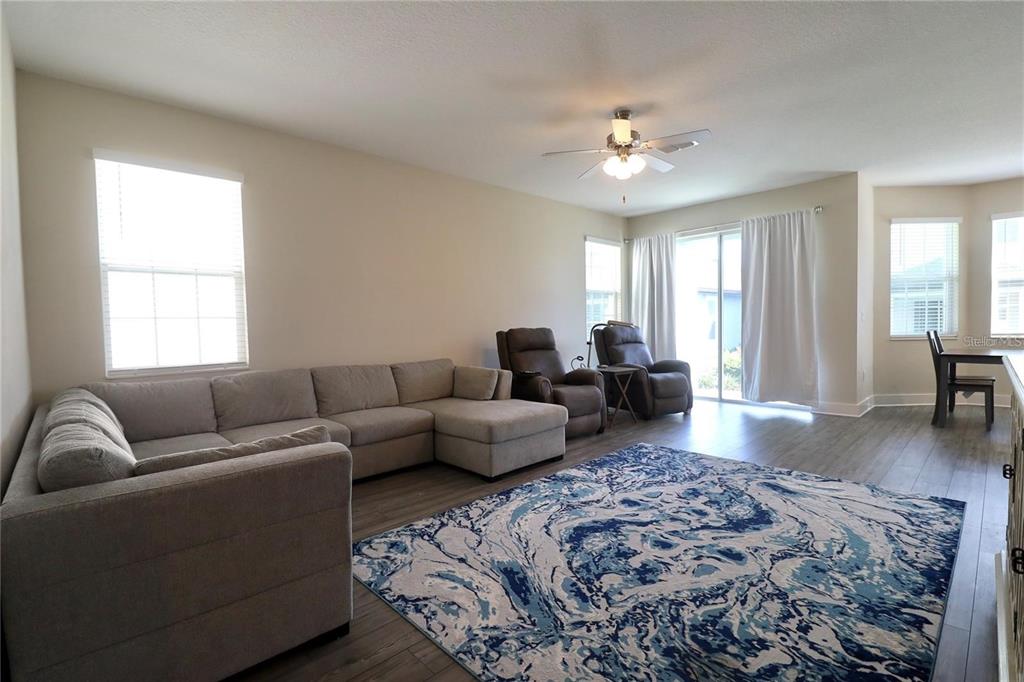 7955 Delwin Lane Reunion, FL 34747 - Photo 6 of 25 a living room with furniture and a couch
