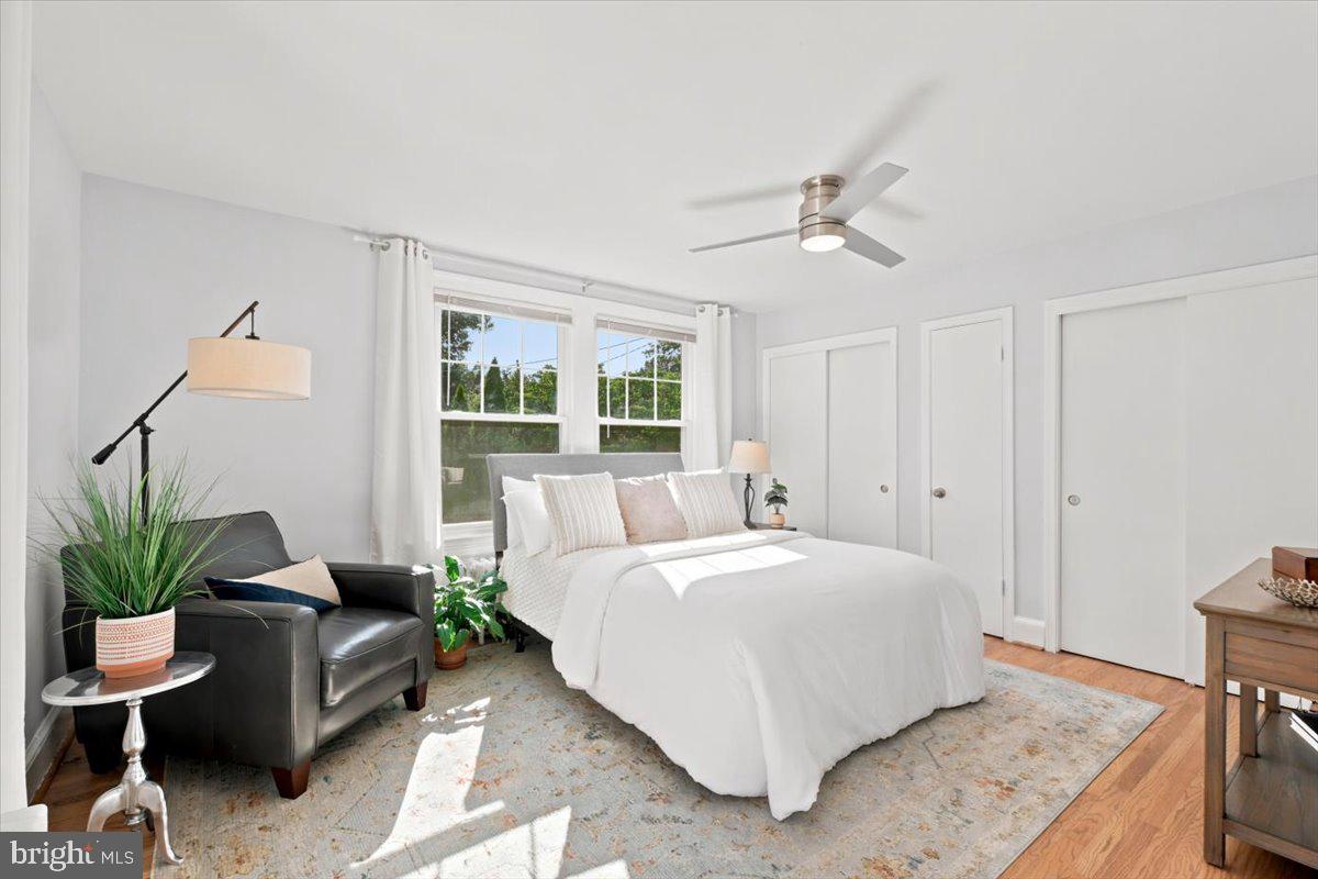 2800 South Arlington Ridge Road Arlington, VA 22206 - Photo 22 of 54 a bedroom with a bed table and a couch